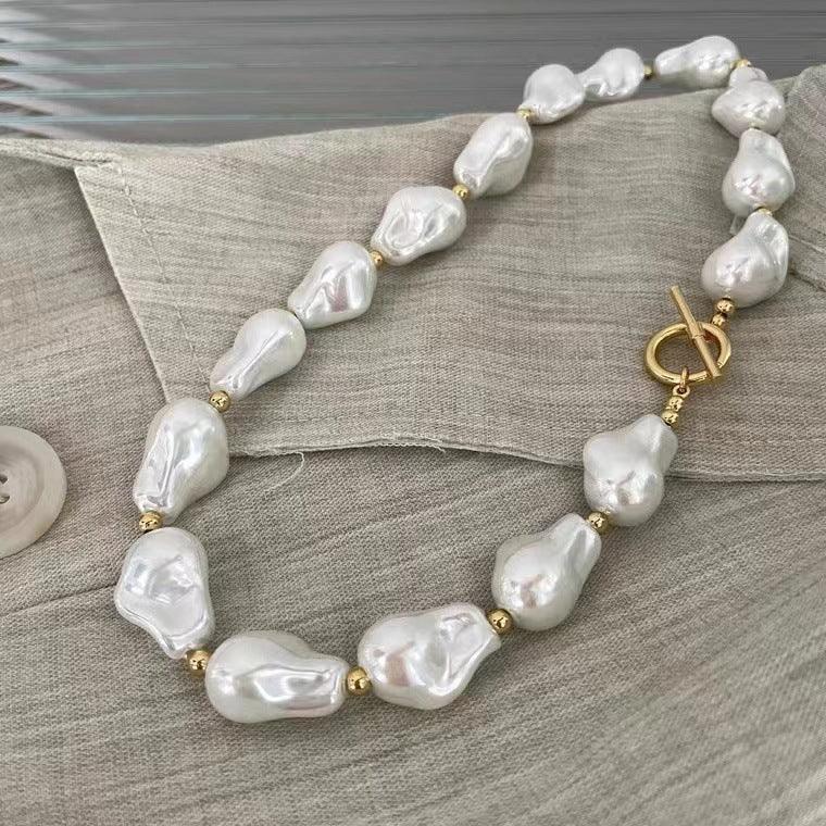 BAROQUE HOLOGRAPHIC PEARL WILMA PEARL NECKLACE featuring a clean chic design and modern white color ,perfect for dailylife/party/office/casual occasion. Styled against a cotton background.