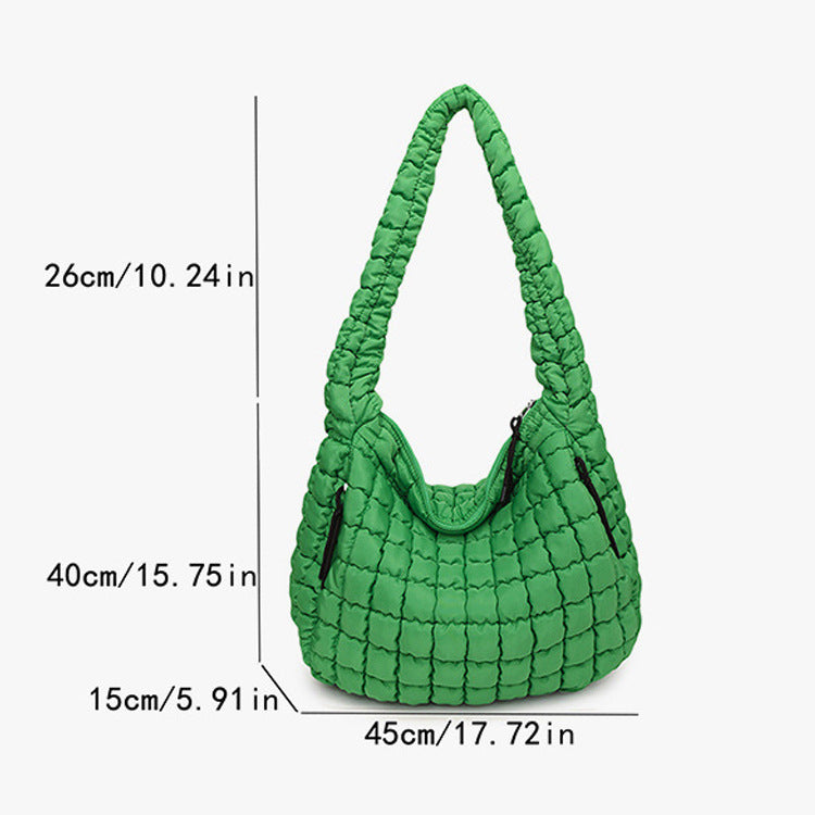 Green quilted handbag with dimensions indicated on a white freepeople coupon sale code skirt puffer bag dress white crop top girl cute clothing mindfully outfits cottagecore cotton good quality comfy chic vacation daily White quilted handbag on a white backgroundbackground