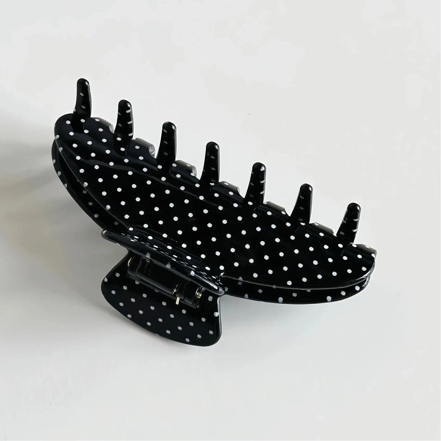Big Effing Clip in Black Polka Dot Black hair clip with white polka dots on a light gray background