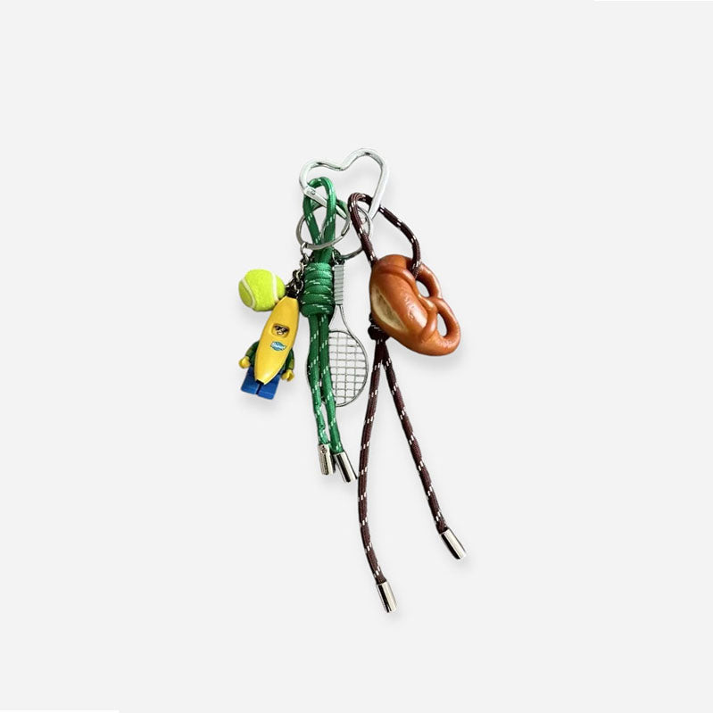 Premium tennis bananaman pretzel bow  bag charm, handcrafted in a unique character design, fashionable pink ornament for bags and gifts