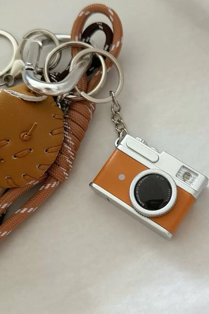 Handcrafted leather dog camera baseball bag charm in dachshund shape, elegant handbag ornament and gift for dog owners and fashion enthusiasts