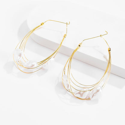 GORGEOUS GIANT BAROQUE PEARL GOLD HOOP EARRINGS featuring a clean chic design and modern white color ,perfect for dailylife/party/office/casual occasion. Styled against a white background.