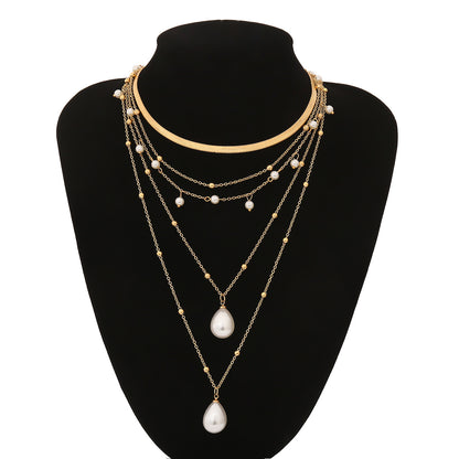 MULTI LAYER WATER DROP PEARL PENDANT WEDDING NECKLACE featuring a clean chic design and modern nature gold and pearl color ,perfect for dailylife/party/office/casual occasion. Styled against a black mannequin background.