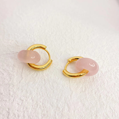 ROSIE ROSE QUARTZ HOOP EARRINGS Delicate rose quartz hoop earrings featuring polished gemstones and a sleek metal finish, adding a touch of elegance and charm to any look