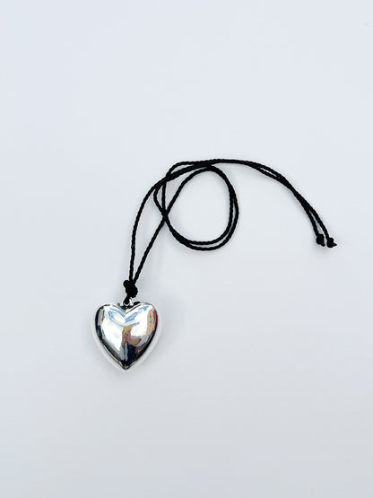 Puffy 3D Heart Necklace featuring a clean chic design and modern nature gold/silver and black braided rope ,perfect for dailylife/party/office/casual occasion. Styled against a white background.