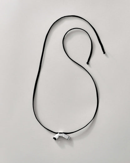 PETITE BOW FAUX SUEDE RIBBON CRAVAT NECKLACE featuring a clean chic design and modern sharp silver and black color ,perfect for dailylife/party/office/casual occasion. Styled against a white background.