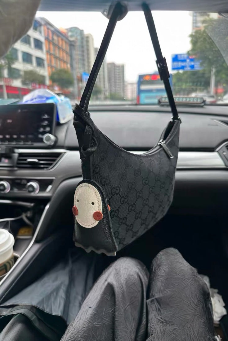 Luxury cute no face leather bag charm in black, handcrafted for handbag decoration, tote personalization, and unique gifts