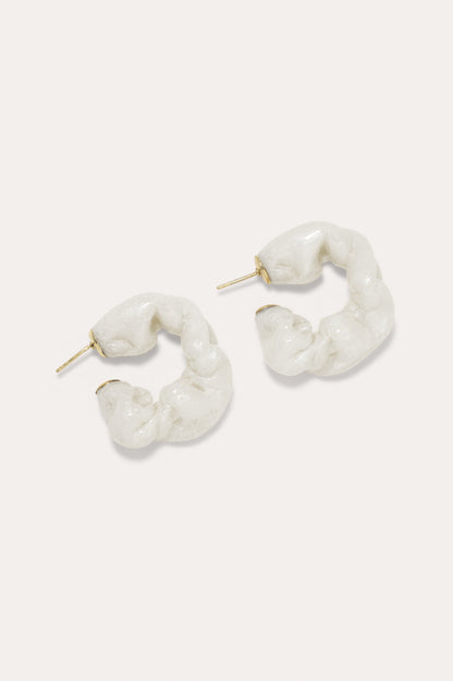 CULT STATEMENTPIECES BLUE BIO RESIN GOLD VERMEIL EARRINGS featuring a clean chic hoop design and modern jelly white color ,perfect for dailylife/party/office/casual occasion. Styled against a white background.