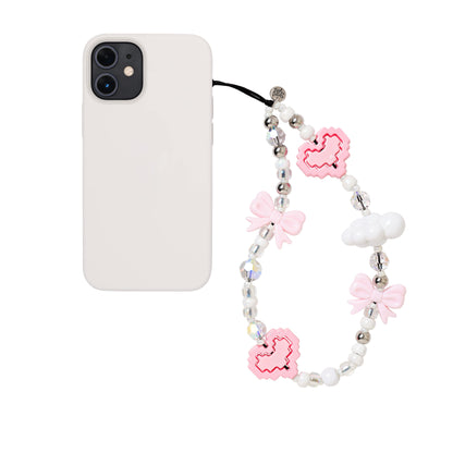 Lisa The Princess Wristlet Phone Strap Close-up of a stylish wristlet phone strap in durable material, featuring a secure loop for easy carrying and a sleek high quality white pearl and pink cloud/bows/ heart bead design for everyday convenience.