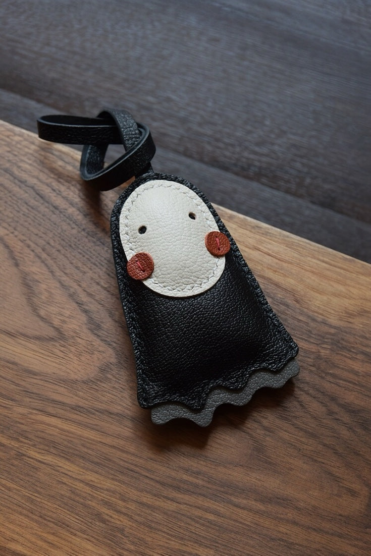 Luxury cute no face leather bag charm in black, handcrafted for handbag decoration, tote personalization, and unique gifts