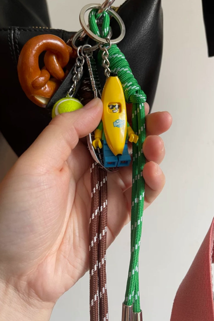 Premium tennis bananaman pretzel bow  bag charm, handcrafted in a unique character design, fashionable pink ornament for bags and gifts