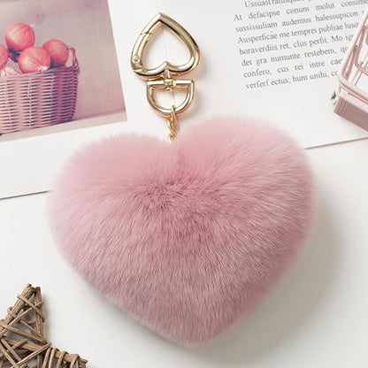 Genuine Rex Rabbit Hair Fur Pompom Keychain Heart Shaped Bag Charm Ring Fluffy Fur Ball featuring a clean chic design and fluffy pinky classic color ,perfect for daily /party/casual/office bagcharm/chain charm decoration . Styled against a white background.