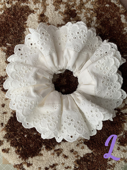 Sweet Dreams Scrunchie in White Daffodil oversized Soft and stylish cotton linen lace scrunchie feature a linen decorated design for added charm. A must-have statement accessory, they can be styled as bracelets or used to adorn any bun, completing your daytime look.