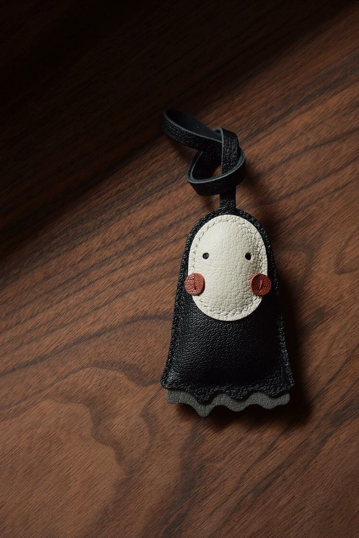 Luxury cute no face leather bag charm in black, handcrafted for handbag decoration, tote personalization, and unique gifts