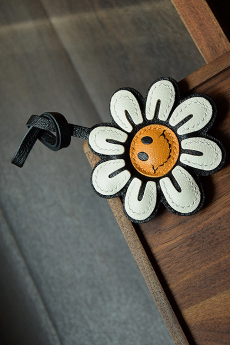 Smile Sunflower Handcrafted leather  bag charm, eco-friendly luxury accessory for tote bags, crossbody bags, and gifts.