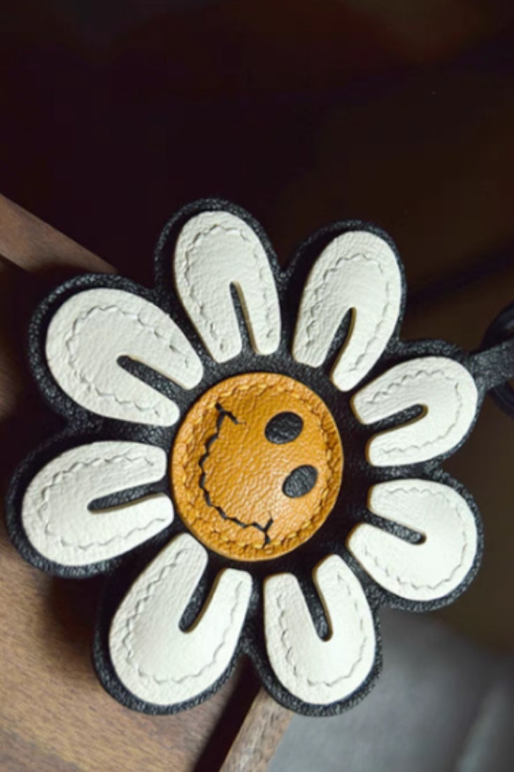 Smile Sunflower Handcrafted leather  bag charm, eco-friendly luxury accessory for tote bags, crossbody bags, and gifts.