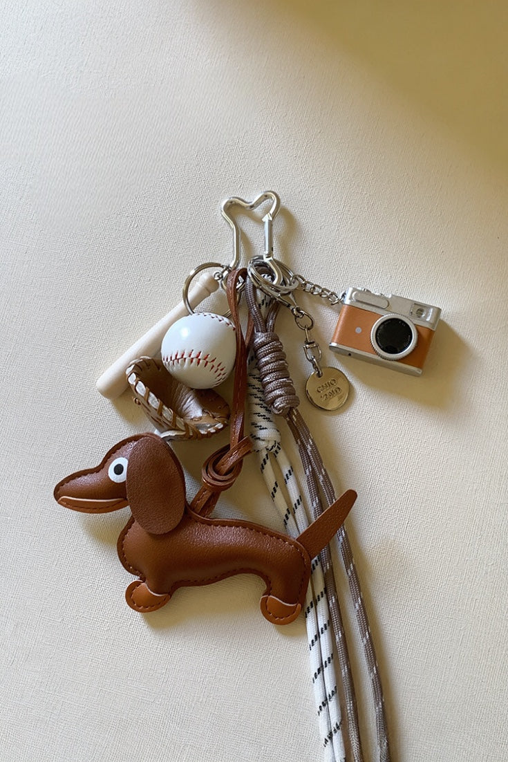 Handcrafted leather dog camera baseball bag charm in dachshund shape, elegant handbag ornament and gift for dog owners and fashion enthusiasts