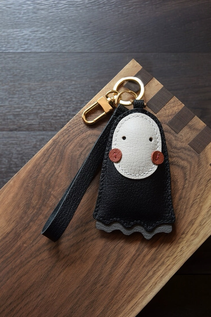 Luxury cute no face leather bag charm in black, handcrafted for handbag decoration, tote personalization, and unique gifts