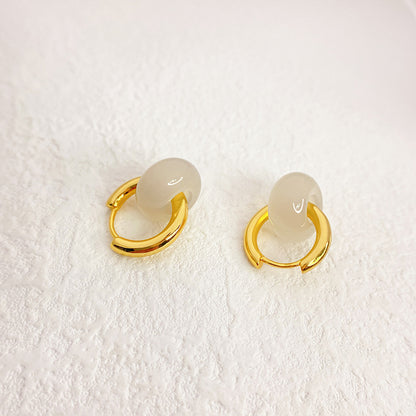 ROSIE ROSE QUARTZ HOOP EARRINGS Delicate rose quartz hoop earrings featuring polished gemstones and a sleek metal finish, adding a touch of elegance and charm to any look