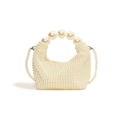 STATEMENTS OF HANDMADE PEARL BEADED HANDBAG WHITE featuring a clean chic pearl of big and small design  ,perfect for dailylife/party/office/casual occasion. Styled against a white background with sitting the bag.